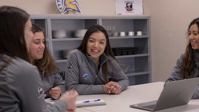 Hospitality students working together at a table