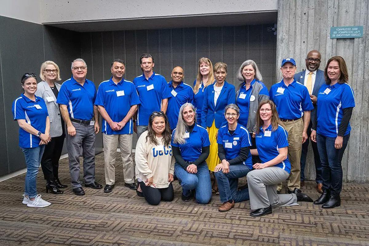 President Teniente posing with Family Advisory Board members.