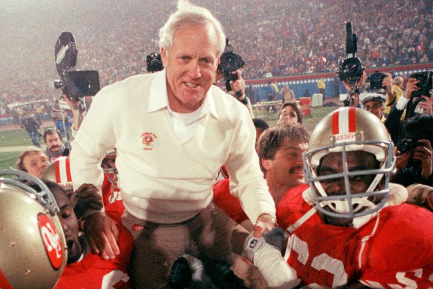 Bill Walsh being carried on the shoulders of the football team.